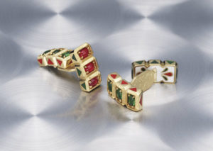 Cynthia Renée gold cufflinks inspired by a vintage pair of Indian cufflinks. Six cabochon emeralds and rubies set with white enamel in 22 karat yellow gold.