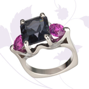 Cynthia Renee Collection ring in 950 palladium featuring a rare 6.81 ct. Graphite-colored Spinel from Burma accented by a pair of 2.07 ct. hot Pink Sapphires from Madagascar.