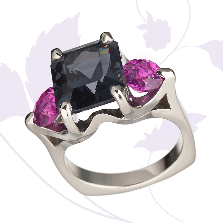 Cynthia Renee Collection ring in 950 palladium featuring a rare 6.81 ct. Graphite-colored Spinel from Burma accented by a pair of 2.07 ct. hot Pink Sapphires from Madagascar. 