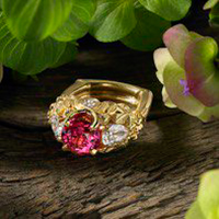 "Miradoniz" ~ Cynthia Renée full custom design ring in 18 karat yellow gold featuring 3.71 carat padparadscha sapphire (Madagascar, heat), a pair of 1.41 carat diamond pears and two additional round diamonds weighing a total of 0.39 carats. Photo by John Parrish.