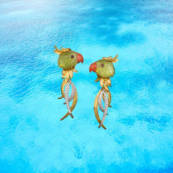 Earrings in 18 karat yellow gold featuring hand-carved Peridot parrots with Coral beaks.