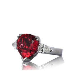 Custom-made palladium ring featuring 8.93 carats Red Spinel (Mahenge, Tanzania) accented by two pear-shaped diamonds weighing 1.23 carats total.