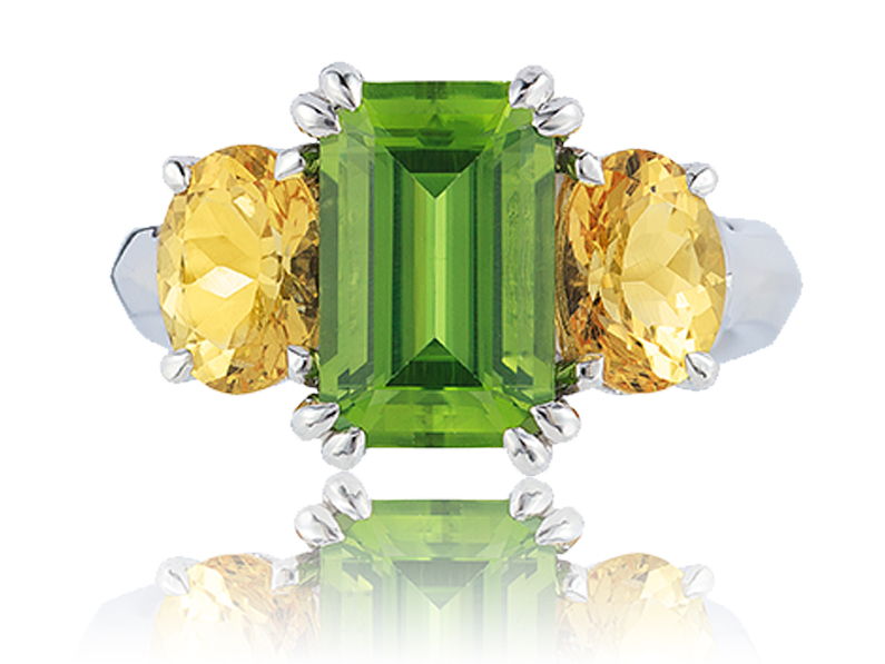 “Heaven and Earth” 3-stone ring in palladium featuring 3.56 carats Peridot accented by 2.02 carats pair of rare Danburite