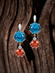 "Genius" ~ Cynthia Renée full custom design earrings in palladium with 14 karat rose gold accent featuring 28.67 carat pair of vivid Blue Zircons (Cambodia) paired with 8.03 carats of tangerine Spessartite garnets (Namibia, natural color). The drops are removable and can be worn with other earring pieces. Photo by Moghadam. THE STORY