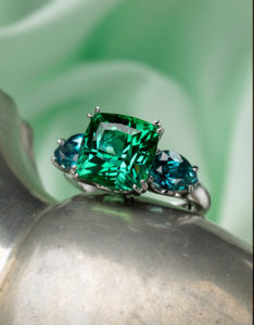 Cynthia Renee Full Custom Design "Mermaid" ring featuring 8.62 carat Afghani Tourmaline flanked by a pair of pear-shaped Blue Zircon and set in 14-karat white gold.