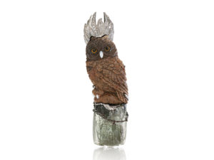 Spectrum award-winner for “Best in Palladium and Color,“ The Owl Queen” brooch/pendant features a great horned owl hand-carved in petrified palm wood; her crown of 950 palladium is accented by 0.15 carats of diamonds and hand granulation.