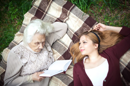 Your Life Story Grandma and girl on a blanket