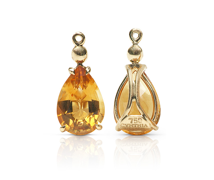 Gem drop pair in 18 karat yellow gold featuring pair of 4.69 carats pear-shape Citrine; gold sphere accent set on Citrine point. Gem drop pair in 18 karat yellow gold featuring pair of 4.69 carats pear-shape Citrine; gold sphere accent set on Citrine point.
