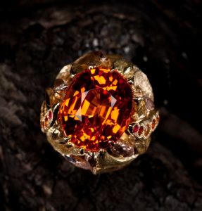 The “Fireball Ring,” featuring a 22 ct. hot orange Spessartite garnet.