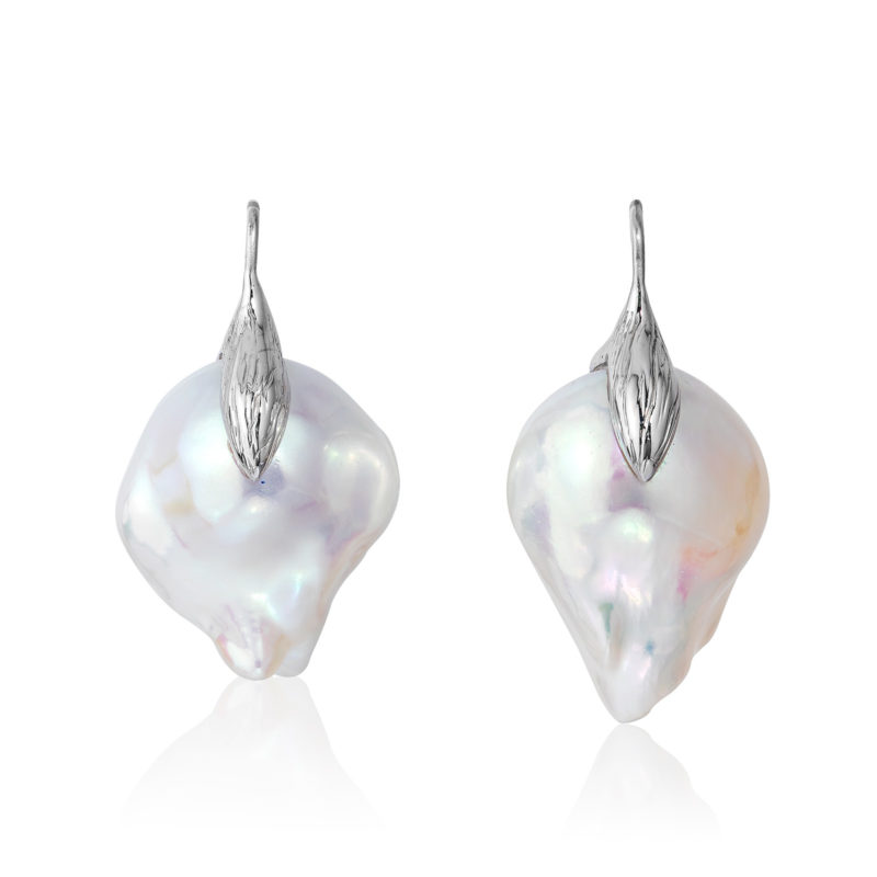 Large and luminous white, 15x21mm, baroque "fireball" pearl earrings crafted with a leaf motif in 18 karat white gold.