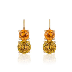 Swan-neck "Double Drop" earrings in 18 karat yellow gold featuring 2.18 carat pair of vivid  Spessartite Garnets (6mm round) accented by 3.94 carat pair of Yellow Zircon (7.5mm round); "swan-neck" wires have locking backs.  