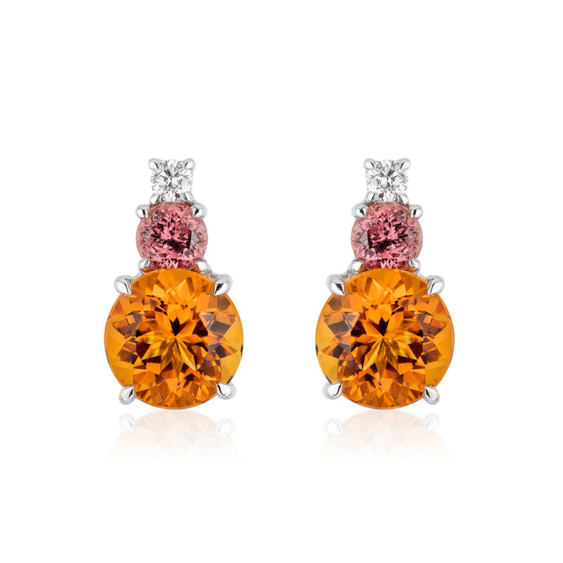 Triple Gem Earrings in 18 karat white gold featuring 6.80-carat pair of Citrine (10mm round), 1.37-carat pair of rare "Umba" Sapphires (5 mm round) and 0.21-carat Diamond accent; post with large friction back.