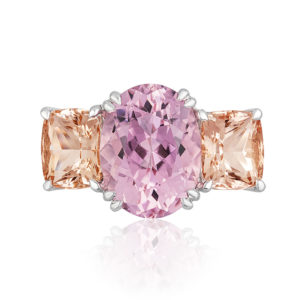 "Heaven & Earth” 3-stone ring in palladium featuring 5.75 carats Pink Tourmaline from Mozambique accented by a pair of 4.51-carats Peach Topaz; size 7 but can size. Natural colors.