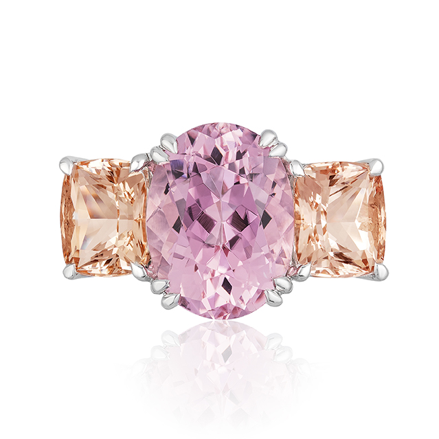 "Heaven & Earth” 3-stone ring in palladium featuring 5.75 carats Pink Tourmaline from Mozambique accented by a pair of 4.51-carats Peach Topaz; size 7 but can size. Natural colors.