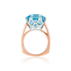 "Trellis Ring" featuring cushion-cut 14.11 ct. Blue Topaz set in 18 kt white gold basket with 18 karat rose gold shank.
