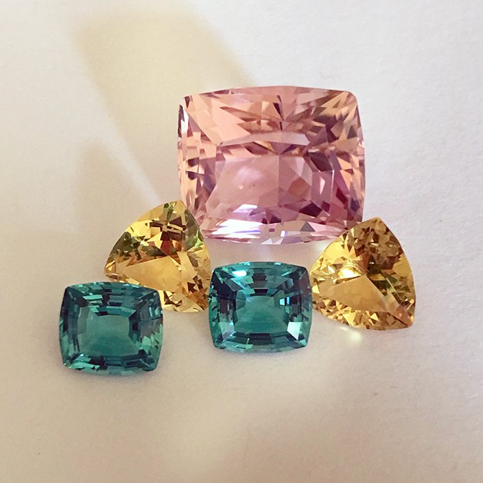 yellow-danburite-and-teal-“cuprian”-tourmaline-gemstones-during-the-design-process