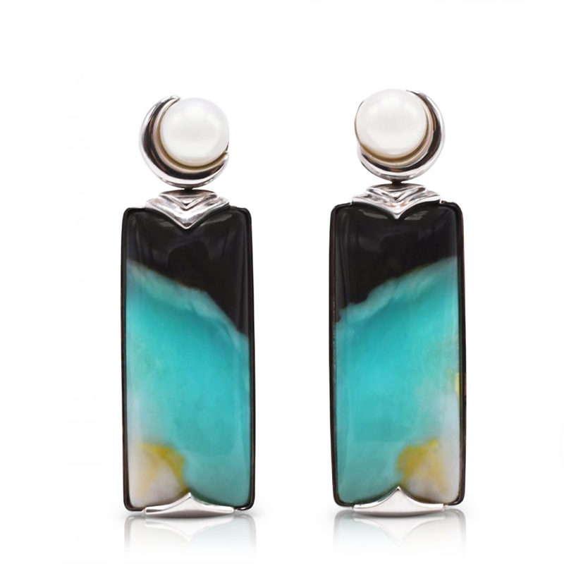 "Crescent" earrings in 18 karat white gold featuring 26.52 carats pair of natural Opalized Wood and a pair of 7-7.5 mm Freshwater Pearl; the opalized wood is found in the West Java Province of Indonesia.