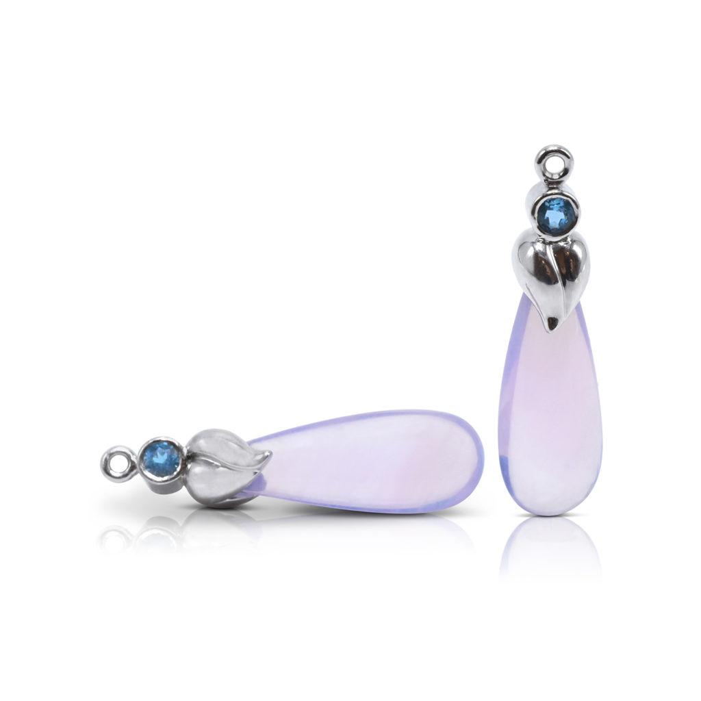Leaf motif Gem Drops in 18 karat white gold featuring 17.77 carats Lilac Quartz smooth briolettes accented by pair of 0.25 carats Blue Zircon.