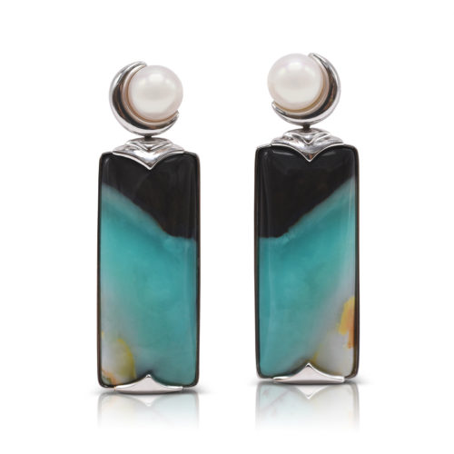 "Crescent" earrings in 18 karat white gold featuring 29.12 carats pair of natural Opalized Wood and a pair of 7-7.5 mm Freshwater Pearl; the opalized wood is found in the West Java Province of Indonesia.