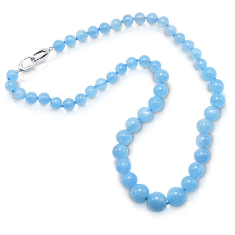 Bead necklace consisting of 51 round, smooth, Aquamarine beads graduating in size from 8.5-12 mm, strung on a knotted thread with an 18 karat white gold trigger clasp; necklace 21 inches long.
