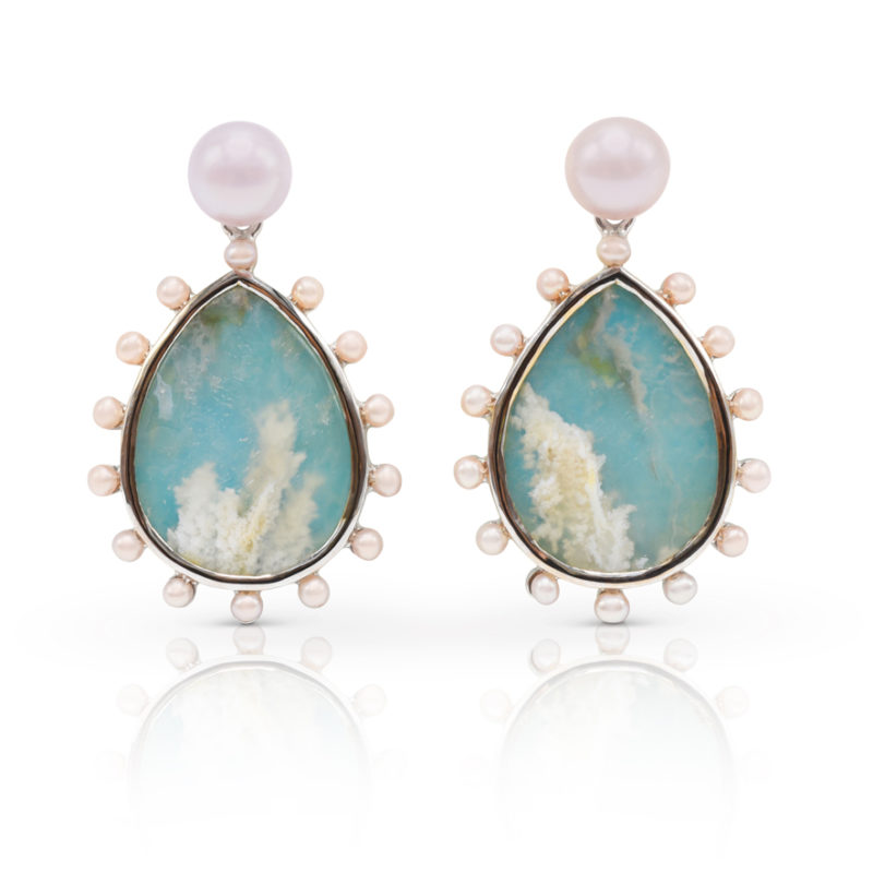 Phoenix earring in 18 karat white gold featuring 15.56 carat pair of “Coral-Sea Turquoise” haloed by 2-mm freshwater pearls suspended from a 7-mm luminous, freshwater pearl stud.
