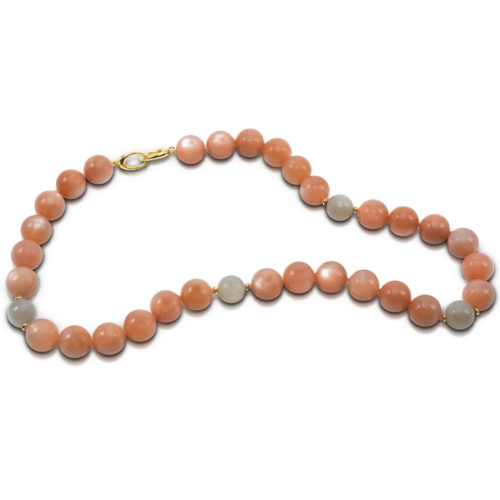 Bead Necklace consisting of 34 pieces of Pink (14-mm) and four Gray (12-mm) Moonstone strung on knotted thread with 14 karat yellow gold double triggerless clasp.