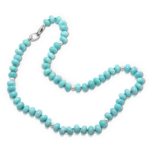 Bead Necklace consisting of 61 pieces of 10x7-mm smooth Amazonite (Peru-N) rondell shaped beads strung with six-5-mm freshwater pearls on knotted thread with 14-karat white gold double triggerless clasp; 21 inches long.