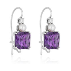 Triple Gem "Swan-neck" Earrings in 18 karat white gold featuring 6.03 carats pair of Amethyst accented by 4.5-mm white Akoya pearls and 0.12 carats of diamonds.