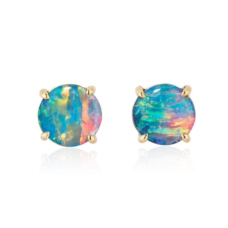 Elegant stud earring in a hand-crafted 18 karat yellow gold setting featuring pair of 1.63 carat Black Opal doublets; opals measure 7-mm round.