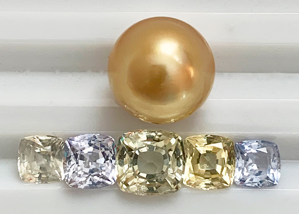 Golden pearl with pastel sapphires