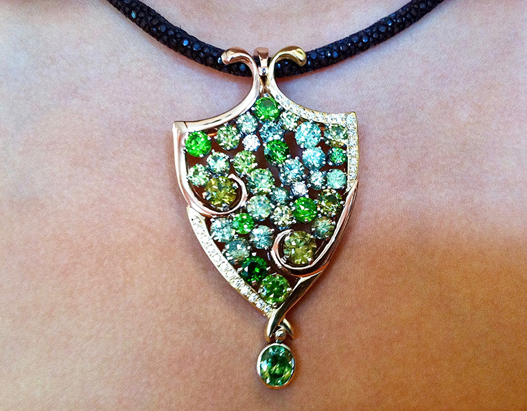 Cynthia Renee Full Custom “ Impressionist” Pendant in 14 karat rose gold, 18-karat yellow gold and palladium featuring a collection of Demantoid Garnets