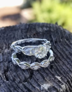 "Growing Together" ~ Cynthia Renee Full Custom design wedding set featuring 1.02 carat center diamond flanked by 5x3 mm pear-shapes; the couple started and own a fabulous organic produce farm and the ring's twisting shapes represent plant tendrils.