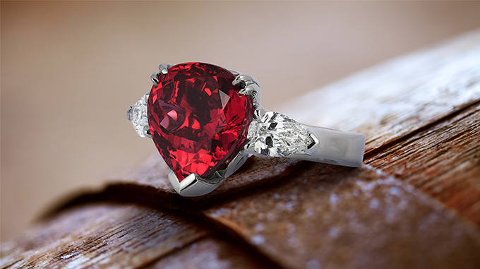 Custom-made palladium ring featuring 8.93 carats Red Spinel (Mahenge, Tanzania) accented by two pear-shaped diamonds weighing 1.23 carats total.