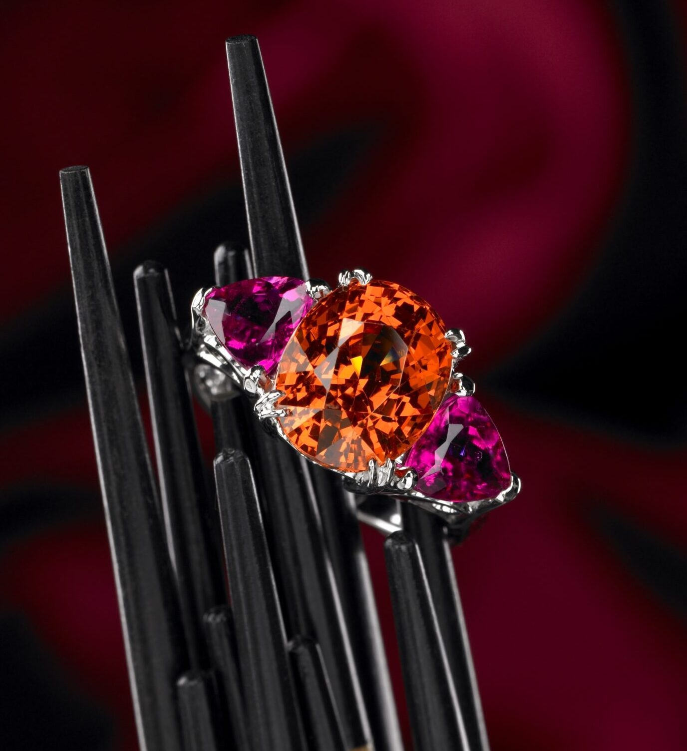 Cynthia Renée custom “India” ring featuring 9.57 carat Spessartite Garnet (Nigeria) and 5.46 carat pair of Red Tourmaline (Nigeria) in 14 karat white gold. 