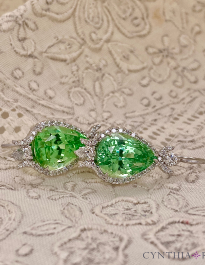 Earrings featuring pair of 11.33 carat "mint" green Grossular Garnets set with 0.61 carats of diamonds in 14 karat white gold.