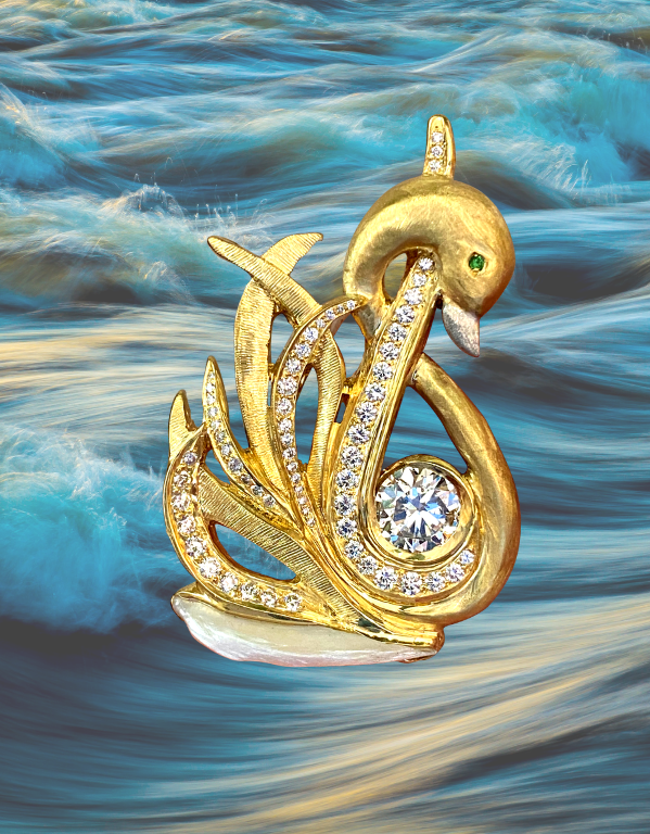 18 karat yellow gold swan with platinum beak featuring 2.02 carat round diamond accented by 64 round brilliant diamonds weighing a total of 1.00 carats featuring a tsavorite garnet eye, glides on a natural wing pearl from the Tennessee River.