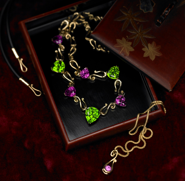 "Orchid" suite of Tanzanian Rhodolite Garnet and Pakistani Peridot. Learn the Story Behind the Jewel.