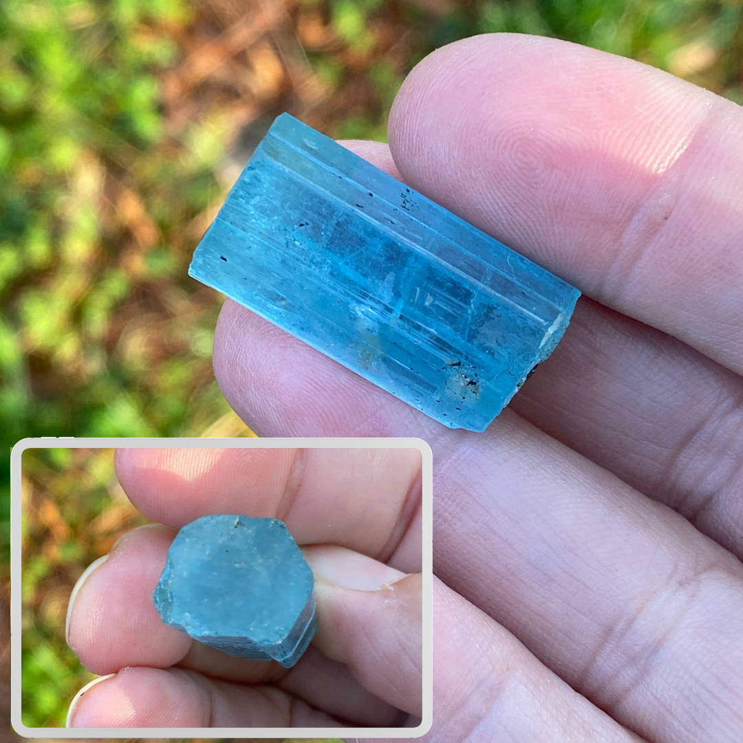 An aquamarine crystal; an emerald-cut gem would be oriented parallel to the crystal’s length.
