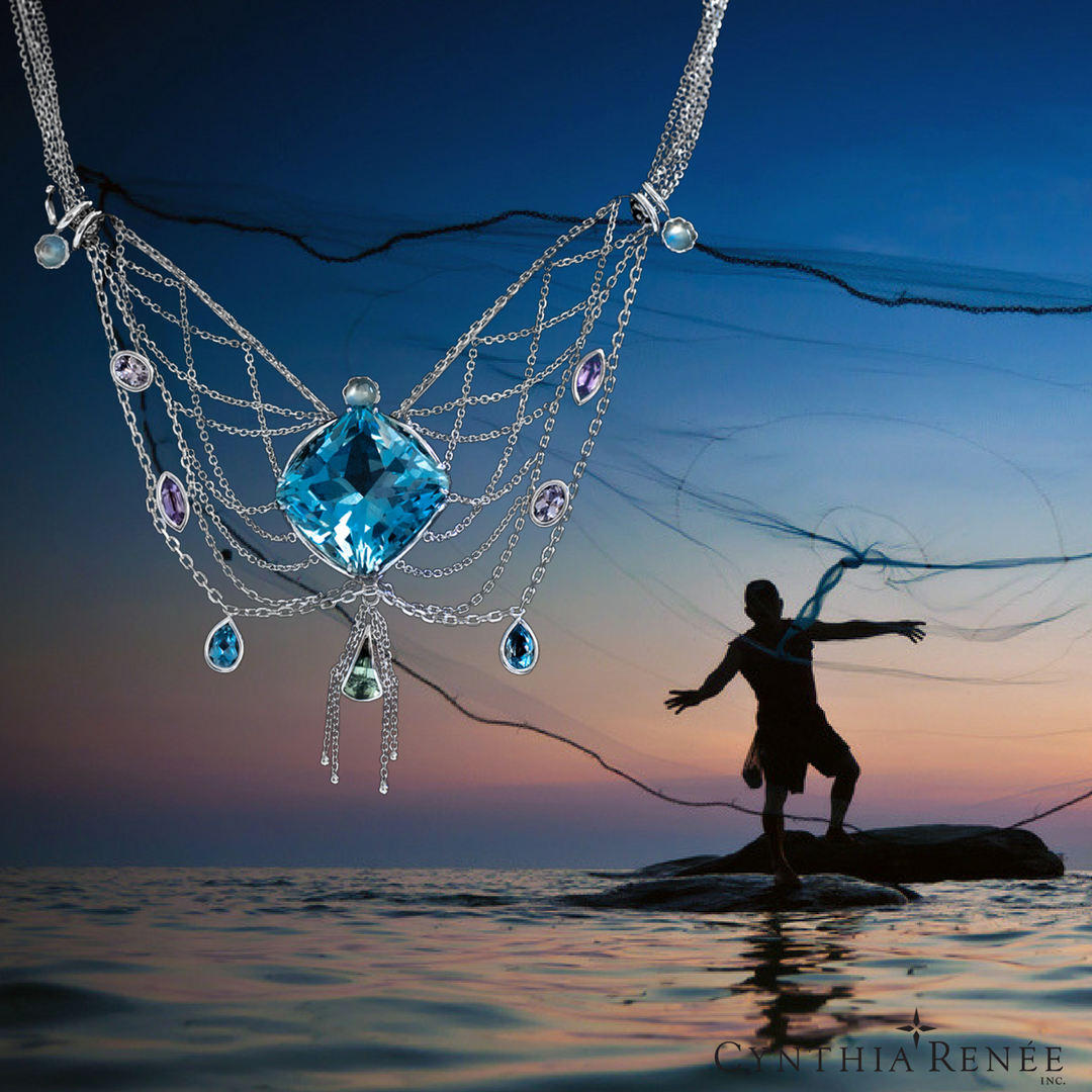 White gold necklace with 30.39 carat Aquamarine, accented by 1.25 carats of moonstone, 1.11 carats tourmaline, 0.51 carats aquamarine, 0.65 carats purple sapphire, 0.73 carats of lavender spinel overlaid an image of mermaid on the rocky shore at sunset overlooking calm sea