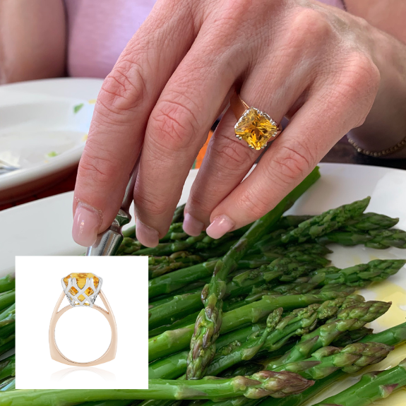 Danburite ring shown next to plate of asparagus