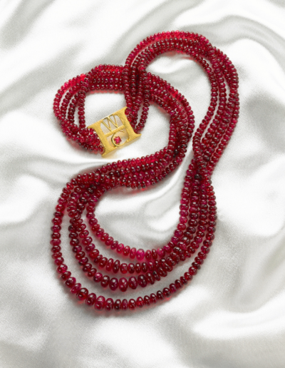 “Red River” ~ Phenomenal multi-strand bead necklace of Red Spinel from Burma with monogram clasp accented by a red spinel crystal.   