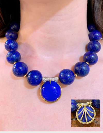 “Lazuli” ~ Cynthia Renee Bespoke interchangeable pendant featuring a 40.20 carat round Lapis cabochon accented by 0.33 carats of pave-set diamonds.  Pendant can be removed and interchange with client’s other clasp/pendants, beads and pearls; 18 kt white gold.